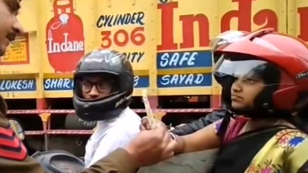நடுரோட்டில் பெண்ணின் ஹெல்மெட்டை உடைத்த போலீஸ்காரர்... காரணம் தெரிந்தால் அதிர்ச்சியடைவீர்கள்