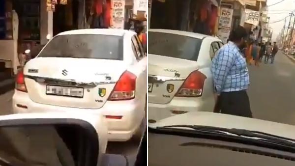 வழியை அடைத்து நின்றதால் அதிரடி... மாருதி டிசையர் காரை அசால்டாக கையில் தூக்கி ஓரமாக வைத்த டிரைவர்...