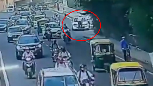 கார் டிரைவர் செய்த காரியத்தால் உறைந்து போன போலீஸ்காரர்... வீடியோ பாக்கறப்பவே அடி வயிறு கலங்குது...