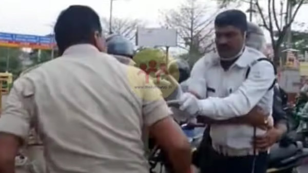 நடு ரோட்டில் குடுமிபிடி சண்டை! காவலர்களின் செயலால் மிரண்டுபோன பொதுமக்கள்... இதுக்கு காரணம் என்ன தெரியுமா?