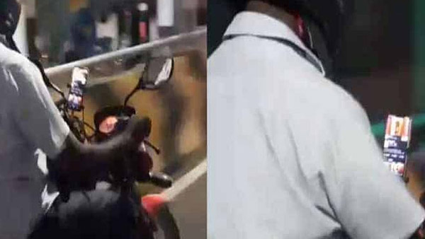 டூவீலரை ஓட்டிக்கொண்டே இந்த நபர் செய்த காரியத்தை பாருங்க... சமூக வலை தளங்களில் வைரலாகும் வீடியோ!